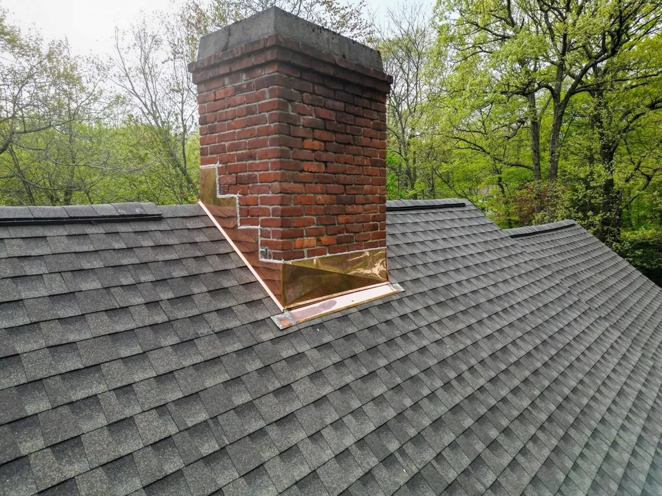 Safeway Roofing NY chimney flashing and shingle roof project