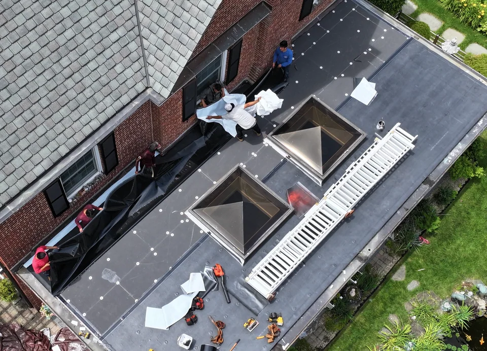 Safeway Roofing NY flat roof installation crew